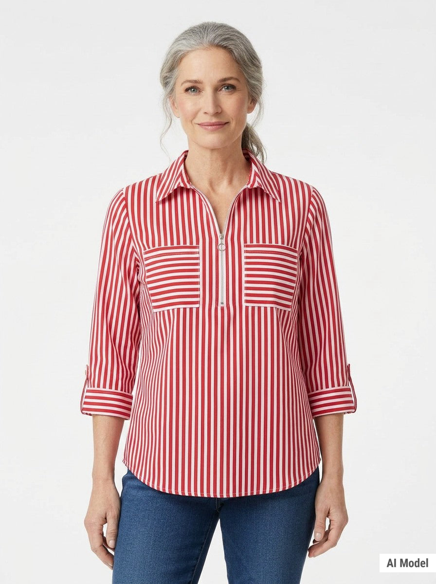 Silver-haired woman wearing a red and white striped half-zip popover blouse with dual chest pockets and rolled sleeves,
