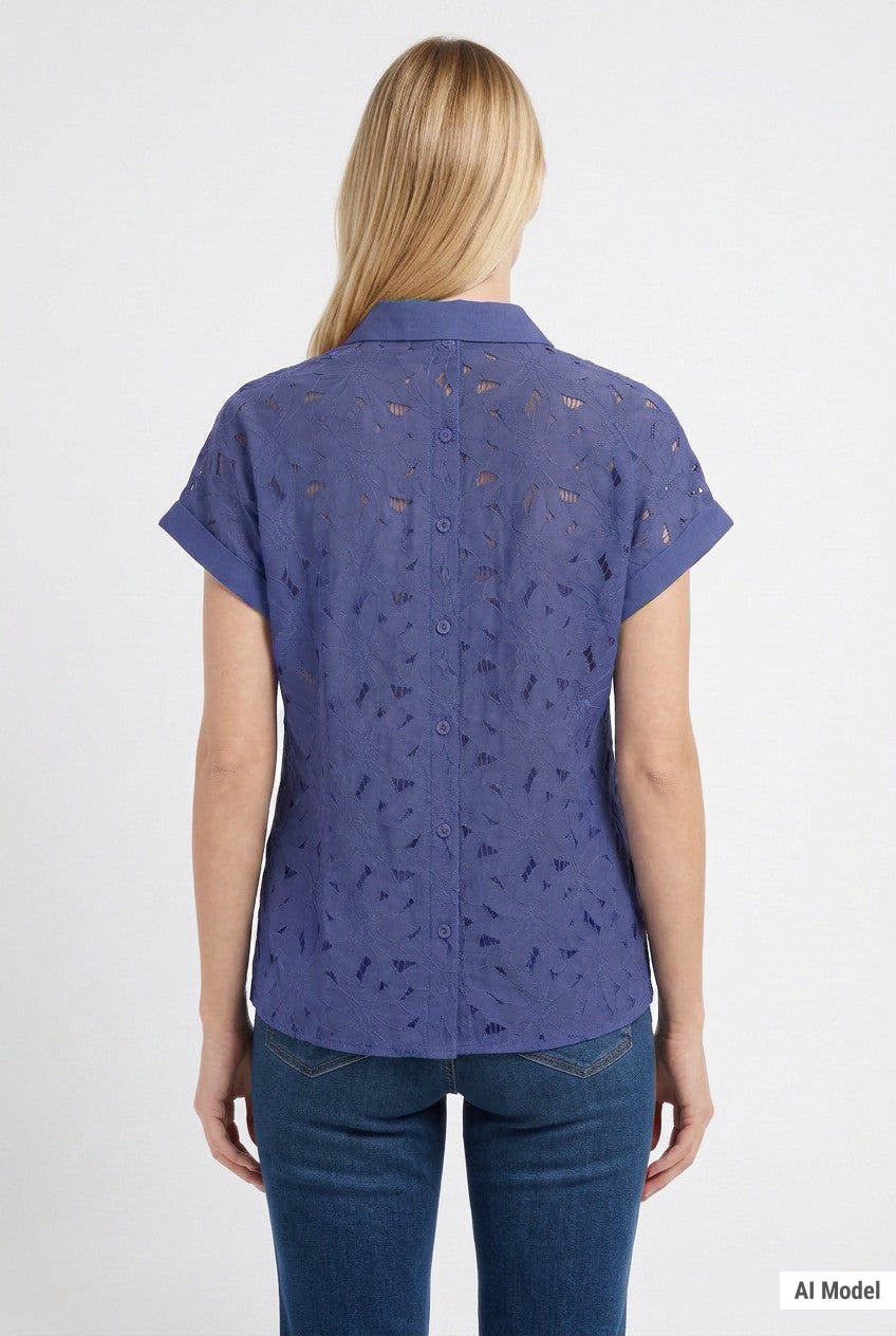 Blonde female model shown from back wearing a patriot blue short-sleeve eyelet button-back blouse with cuffed sleeves,