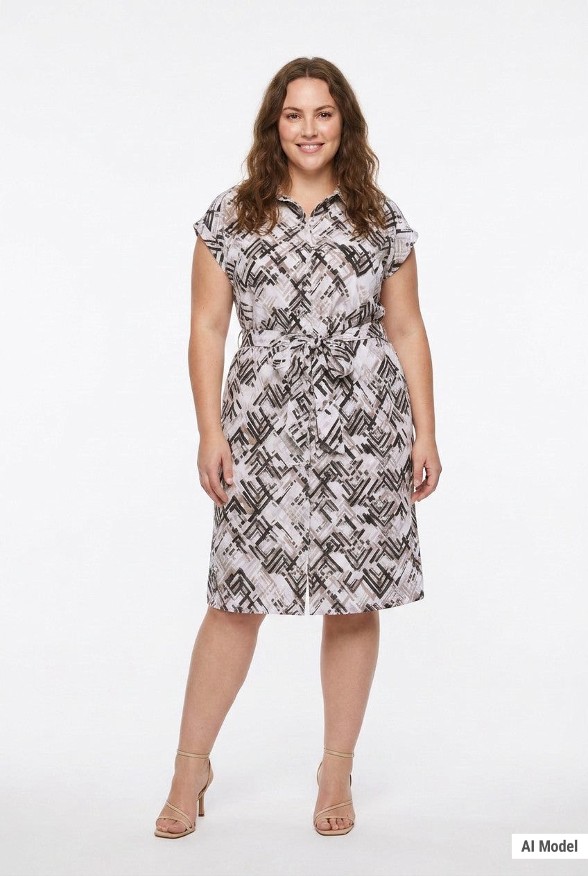 Plus-size model wears a knee-length geometric print shirtdress with collar, cap sleeves, and self-tie belt, front view.
