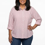 Plus-size women's pink and white striped 3/4 roll-tab sleeve button-front blouse with chest pocket, front view on a model.