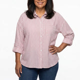 Plus-size women's pink and white striped 3/4 roll-tab sleeve button-front blouse with chest pocket, front view on a model.
