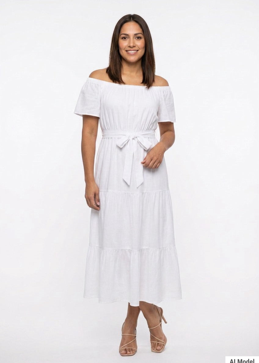 White off-shoulder short-sleeve tiered maxi dress with tie belt; front view on a dark-haired woman wearing nude strappy