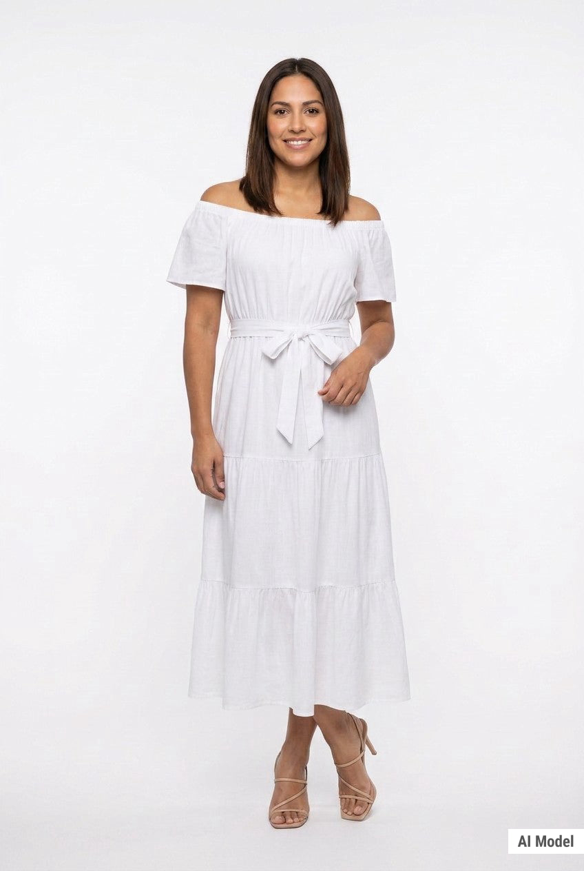 White off-shoulder short-sleeve tiered maxi dress with tie belt; front view on a dark-haired woman wearing nude strappy