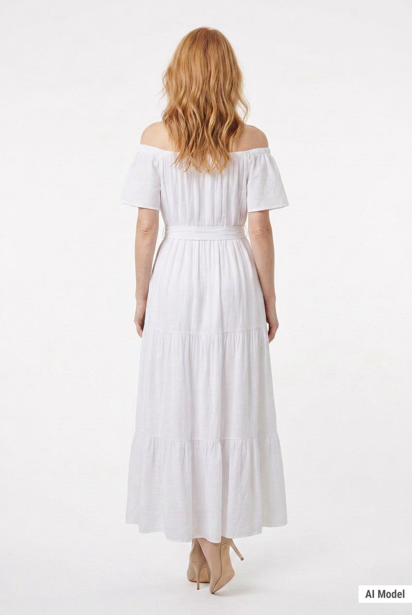 Back view of a woman wearing a white off-shoulder tiered maxi dress with short sleeves and waist belt, shown full-length