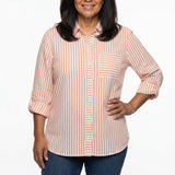 Woman wearing a coral and white vertical-stripe button-front blouse with rolled 3/4 sleeves and chest pocket, front view,