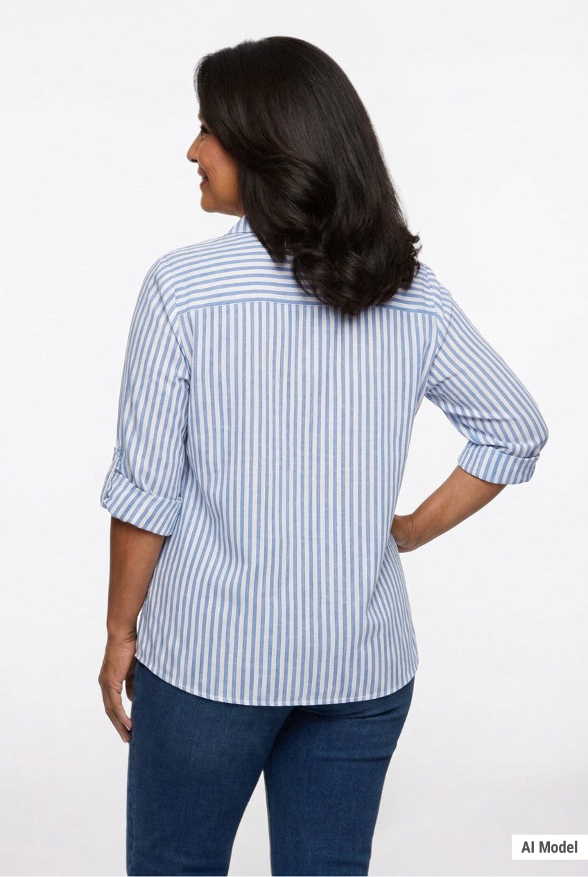 Back view of a woman wearing a blue and white vertical-stripe roll-tab 3/4-sleeve button-front blouse with dark jeans.