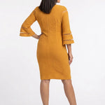 Mustard textured bodycon sheath dress with 3/4 bell sleeves featuring sheer stripe cutouts, worn by a dark-haired woman,