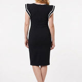 Black petite sheath dress with ruffle sleeves and white contrast tipping, back view, worn by a red-haired woman with nude