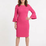Pink textured sheath dress with tiered ruffle bell sleeves and contrast stripe chest detail, worn by a woman, front view.
