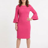 Pink textured sheath dress with tiered ruffle bell sleeves and contrast stripe chest detail, worn by a woman, front view.
