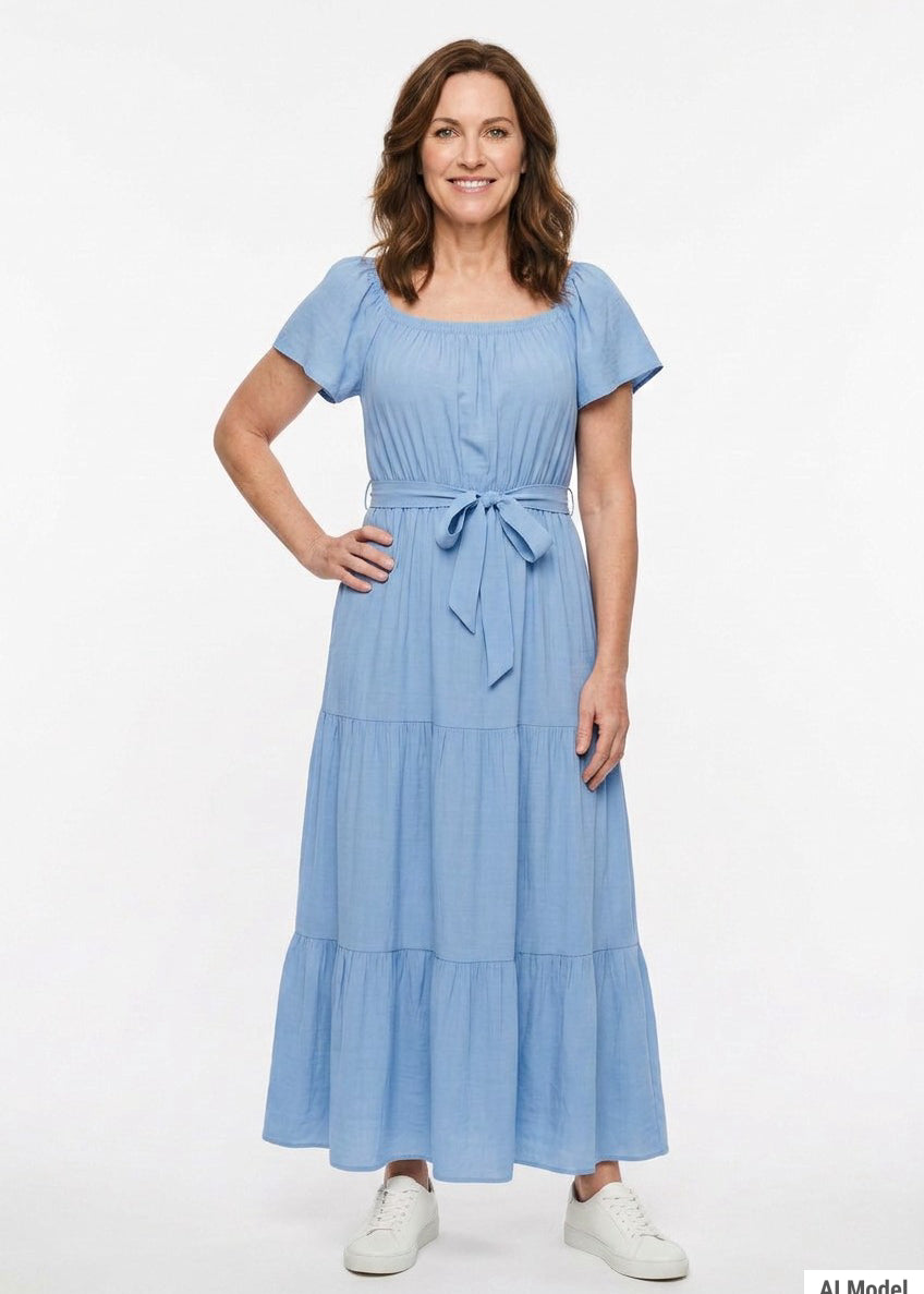 Light blue short-sleeve tiered maxi dress with square neckline and self-tie waist belt, worn by a woman with brown hair,