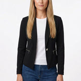 Black cropped collarless crepe jacket with zip pockets and single button on a blonde woman, front view, styled over a white