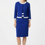 Older woman with gray hair wearing a sapphire blue and white colorblocked 2-piece jacket dress set with elbow sleeves and