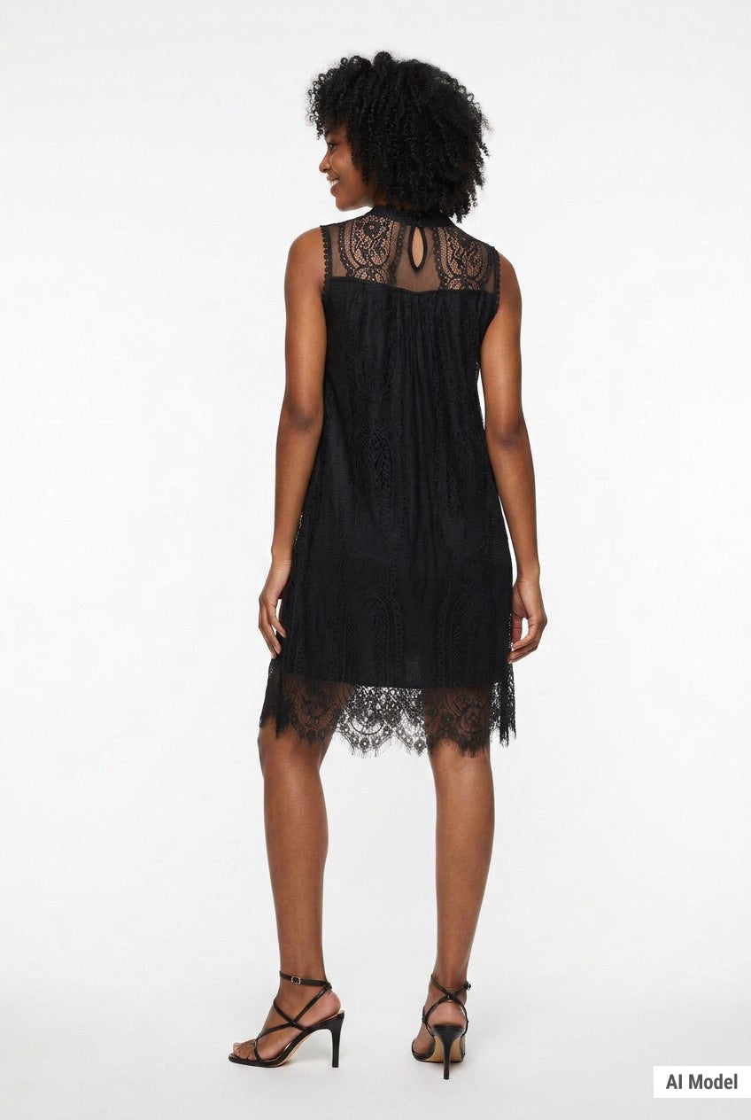Woman wearing a black sleeveless lace shift dress with sheer high neck, scalloped hem, and keyhole back, shown from behind