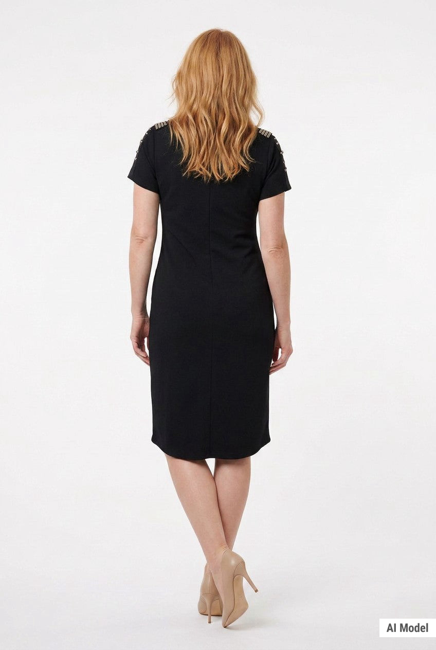 Back view of a woman wearing a black short-sleeve sheath dress with embellished shoulders, knee-length hem, and center back