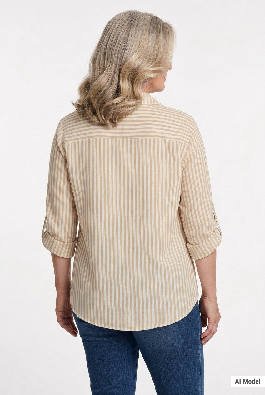 Back view of a woman wearing a tan and white striped roll-tab 3/4 sleeve button-front blouse with blue jeans.