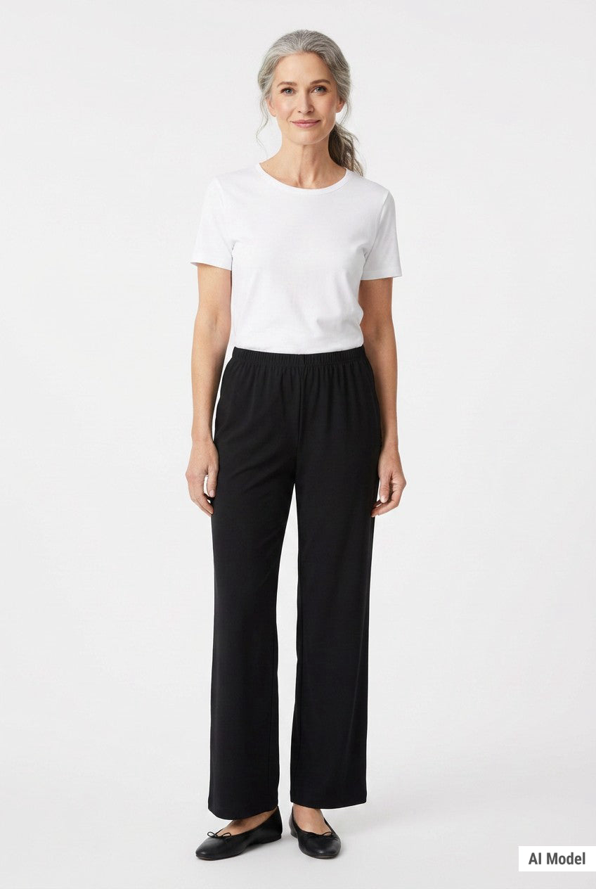 Black pull-on pants with elastic waistband and wide-leg silhouette on a gray-haired woman, front view, full length.