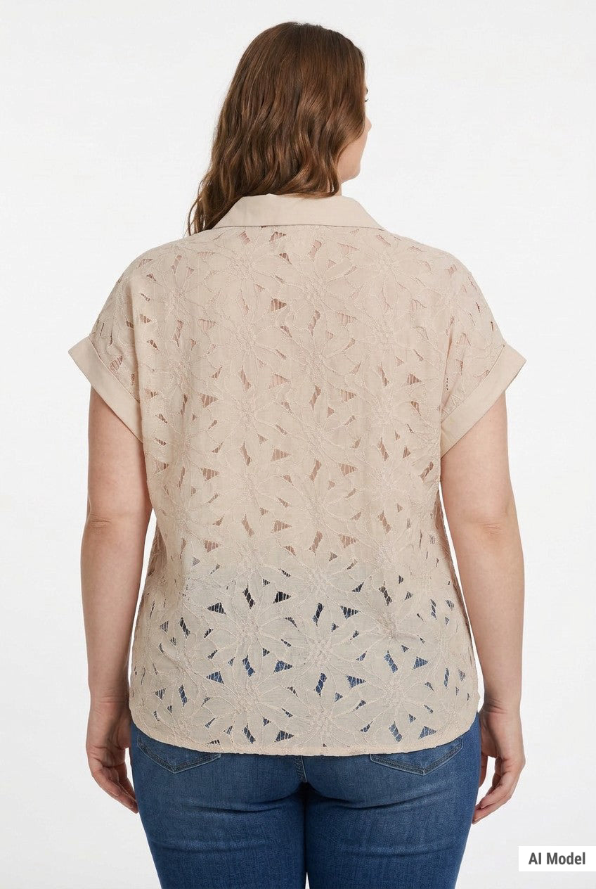 Plus-size model wearing a beige short-sleeve eyelet blouse with collar and cuffed sleeves, paired with blue jeans; rear view.
