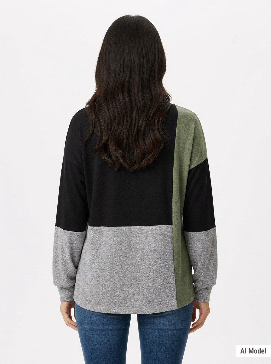 Back view of a women's color-blocked pullover top in black, heather grey, and sage green on a dark-haired female model