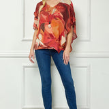 Cold Shoulder V-Neck Hanky Hem Poncho Top in Ivory/Marigold/Orange