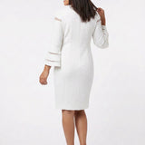 White textured sheath dress with bell sleeves and sheer stripe details, back view, worn by a dark-haired woman with nude
