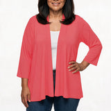 Coral open-front cardigan with 3/4 sleeves on a plus-size model wearing jeans, front view, waist-up shot.