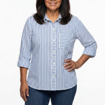 Woman wearing a blue and white striped 3/4 roll-tab sleeve button-front blouse with chest pocket, front view, waist-up shot.