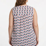 Plus-size model wearing a sleeveless blouse with geometric half-moon print in navy, pink, blue, and tan, with back pintuck