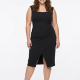 Plus-size model wears a black sleeveless square-neck sheath dress with a front wrap slit and high-waist band; front view.