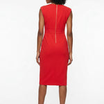 Back view of a Black woman wearing a red sleeveless sheath dress with gold back zipper and waist seam, midi length, paired